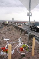 View of Ghost Bike with east bound traffic on Comanche NE